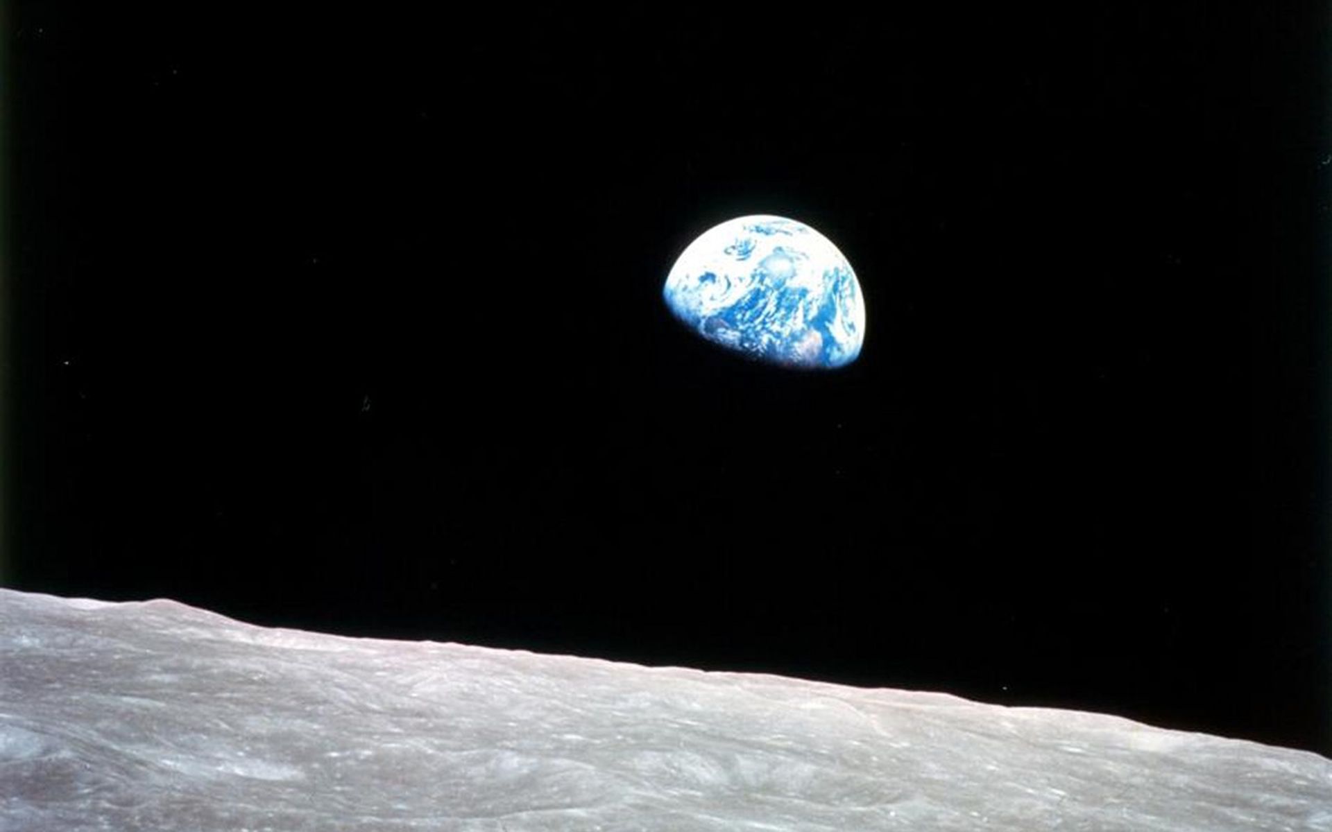 Earth appearing above the lunar horizon in the Apollo 8 Earthrise photograph.